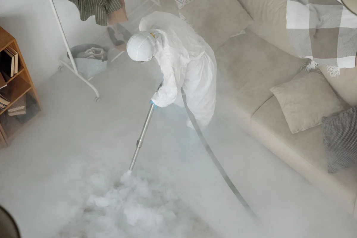 Biohazard cleanup technician in protective equipment, Gladewater, TX